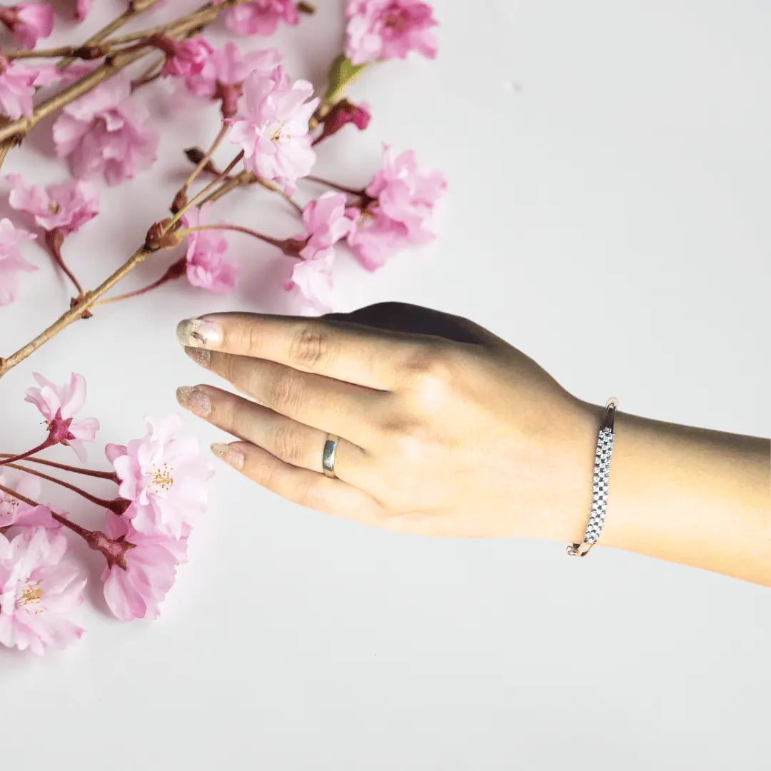 Cubic zirconia bracelet with rhodium plating shown in elegant design