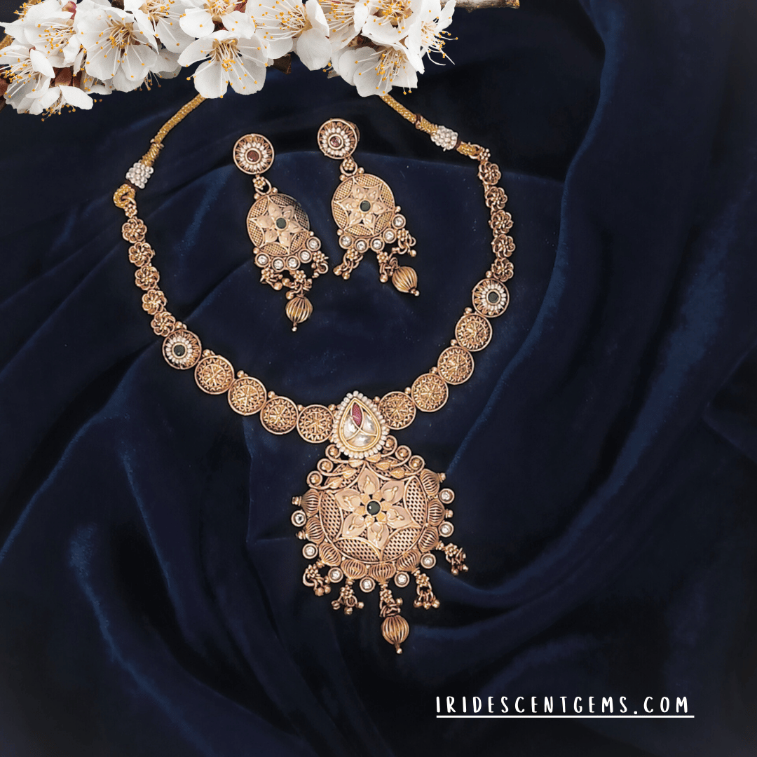 antique gold-plated necklace set with filigree detailing and matching chandbali earrings. Ideal for bridal looks, festive wear