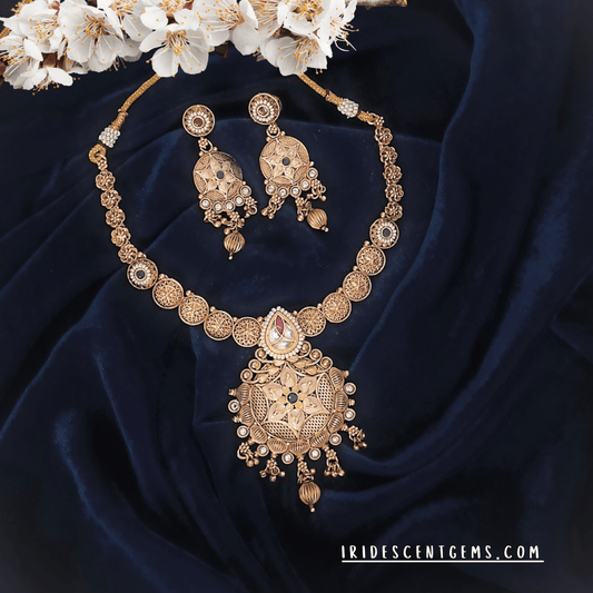 antique gold-plated necklace set with filigree detailing and matching chandbali earrings. Ideal for bridal looks, festive wear