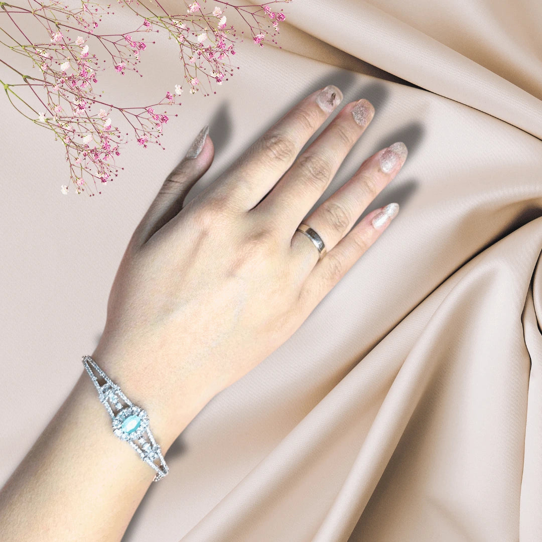 Close-up view of silver bracelet with AD stones on woman's wrist