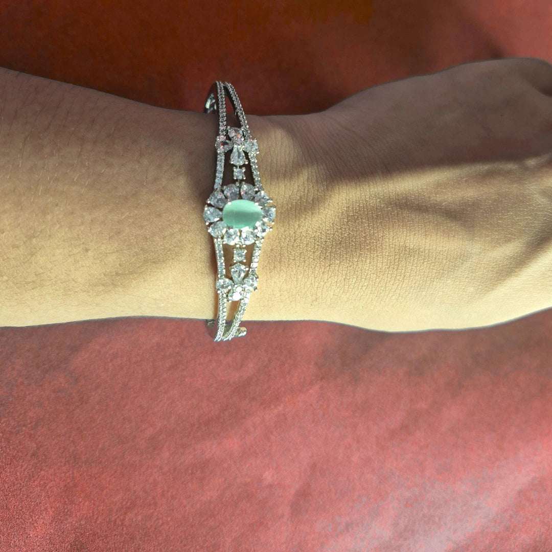 Detailed view of silver bracelet showing AD stone pattern and craftsmanship