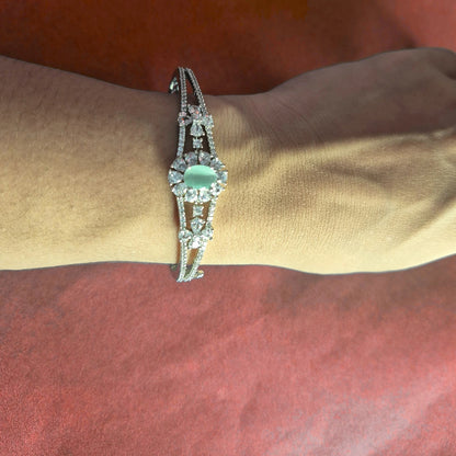 Detailed view of silver bracelet showing AD stone pattern and craftsmanship
